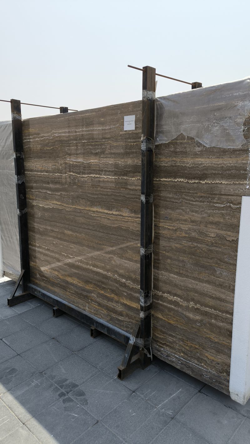 Brown Travertine - Lazulite Marble High-quality brown travertine slab showing warm earthy tones, rich walnut colors, and a natural porous texture.