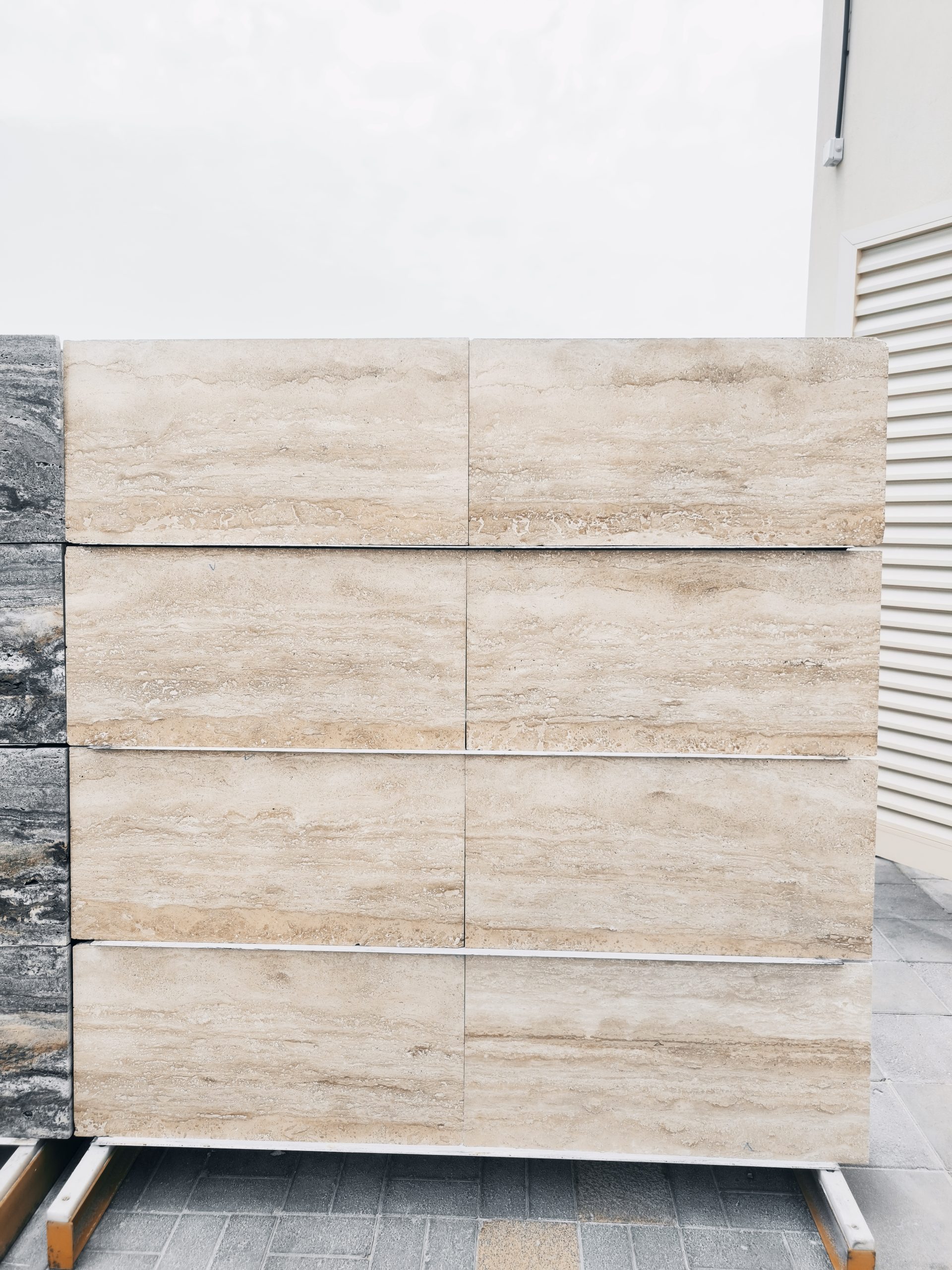 High-quality Travertine Blond slab displaying a warm golden and sunny beige background with natural porous textures.