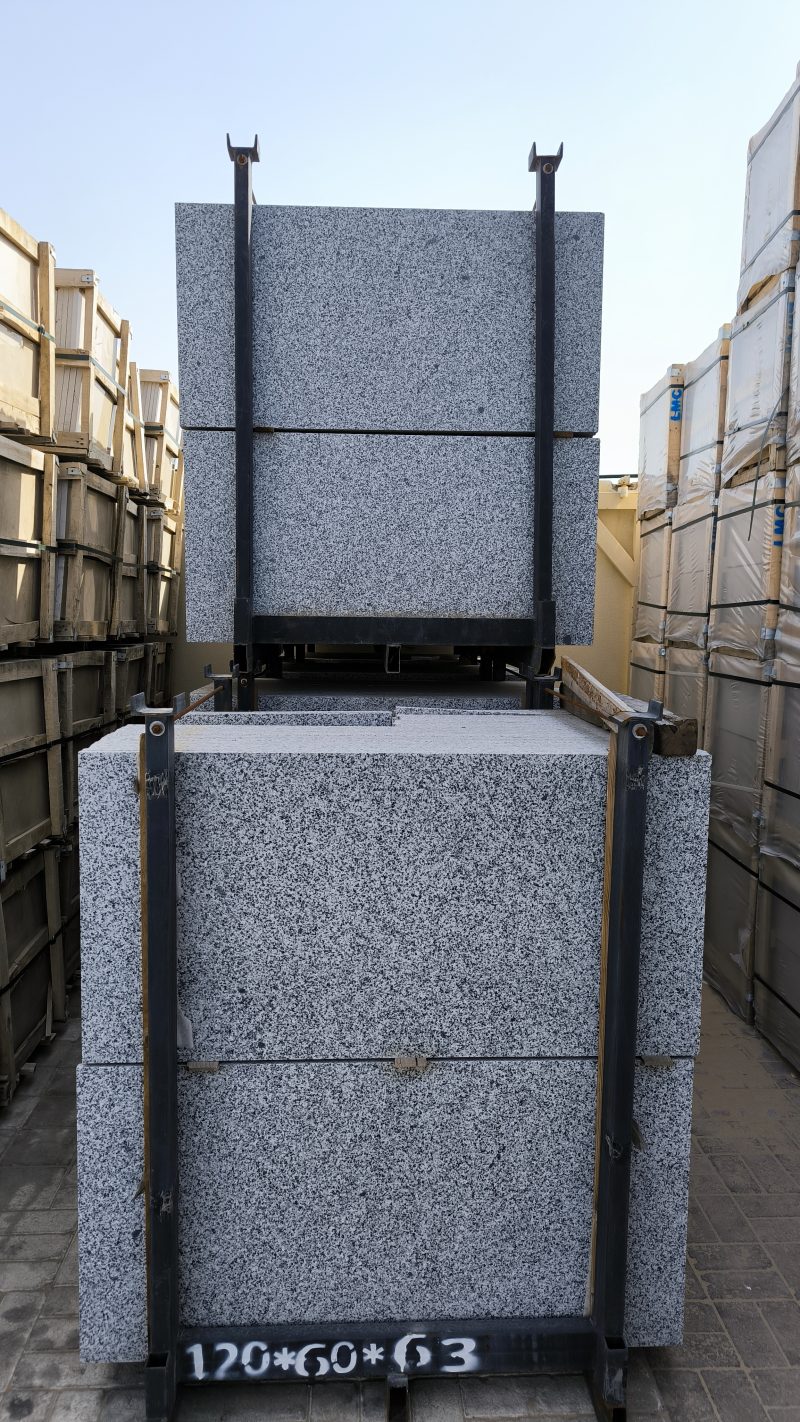 Close-up of Grey Sardo granite showing a uniform grey, black, and white speckled granular pattern.