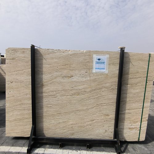 High-quality Travertine Kanyane slab displaying a luminous cream and warm beige background with soft natural textures.