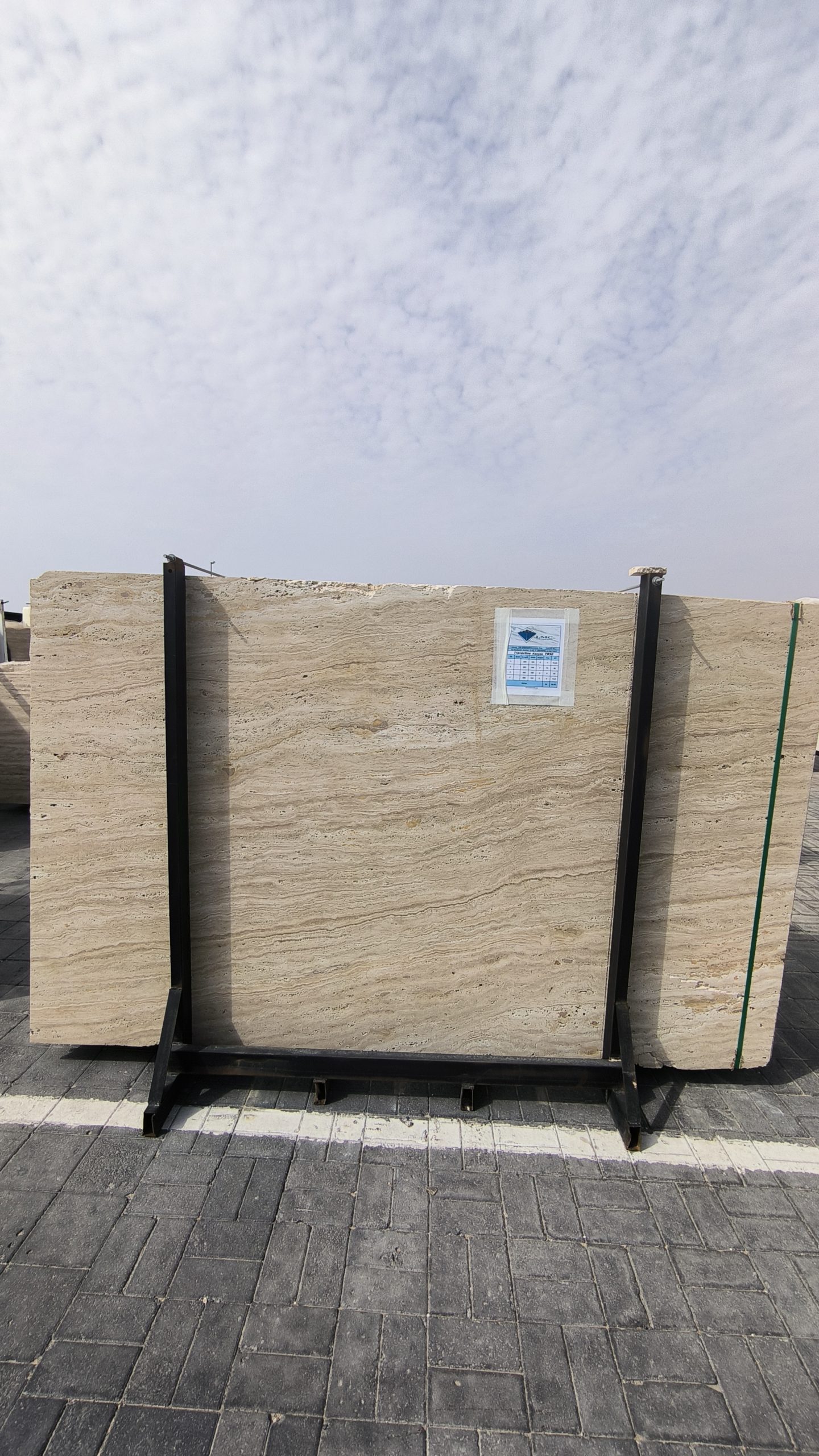 High-quality Travertine Kanyane slab displaying a luminous cream and warm beige background with soft natural textures.
