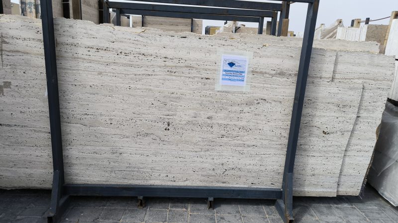 High-quality Travertine Romano slab showcasing a warm ivory and beige background with classic parallel linear veining.