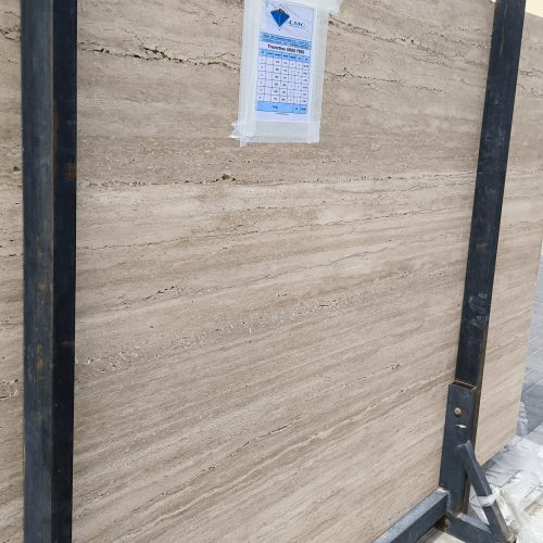 High-quality Travertine Kanyane slab displaying a luminous cream and warm beige background with soft natural textures.