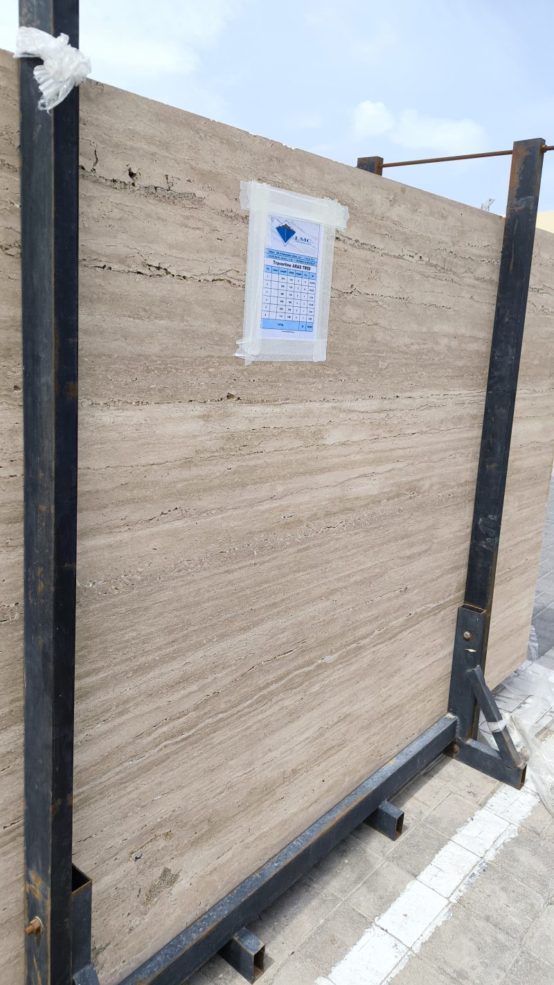 High-quality Travertine Kanyane slab displaying a luminous cream and warm beige background with soft natural textures.