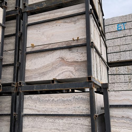 High-quality Travertine Silver Kashan slab displaying a striking mix of cool silver grey and warm earthy brown linear veining.