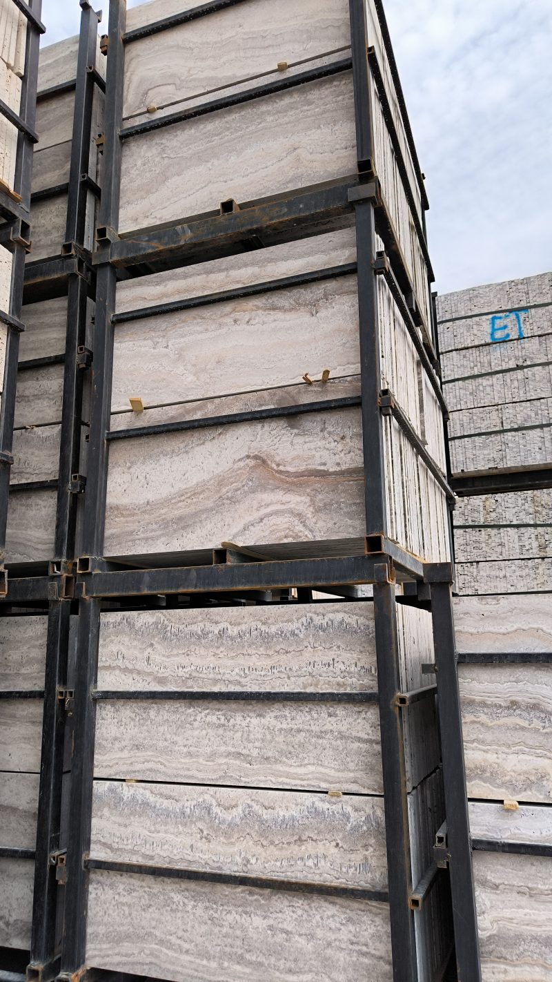 High-quality Travertine Silver Kashan slab displaying a striking mix of cool silver grey and warm earthy brown linear veining.