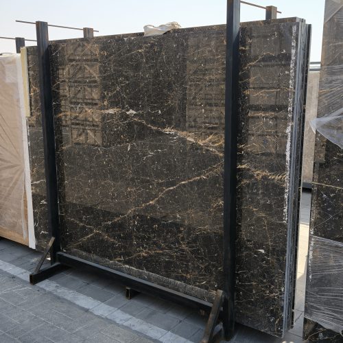 High-quality Golden Black Marble slab displaying a deep black background with striking white lines and random golden flakes.