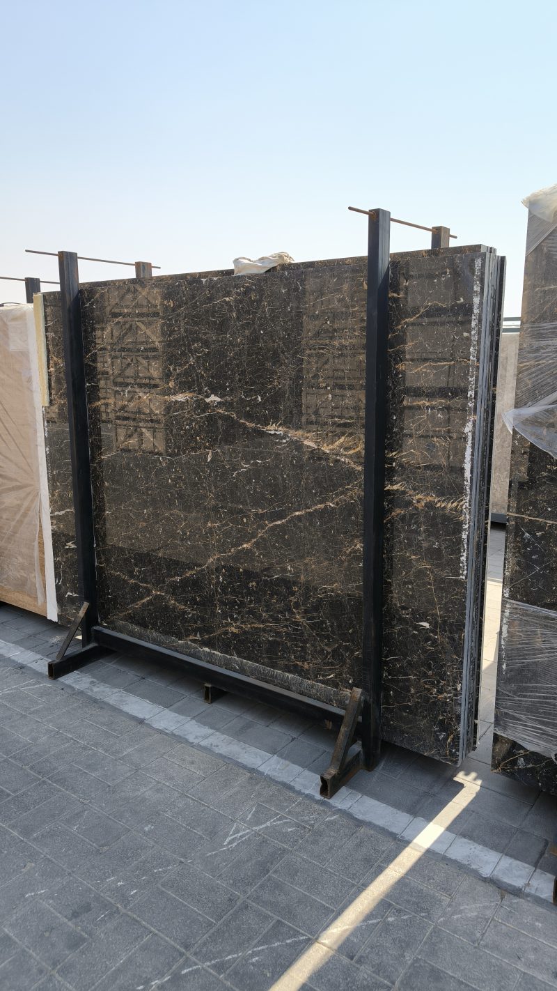 High-quality Golden Black Marble slab displaying a deep black background with striking white lines and random golden flakes.