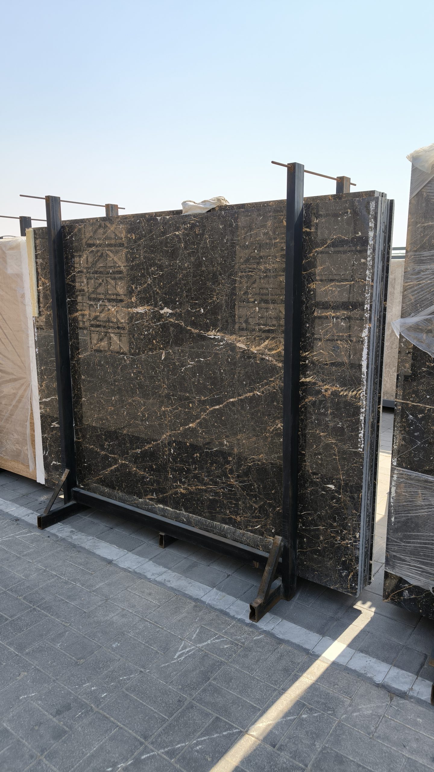 High-quality Golden Black Marble slab displaying a deep black background with striking white lines and random golden flakes.