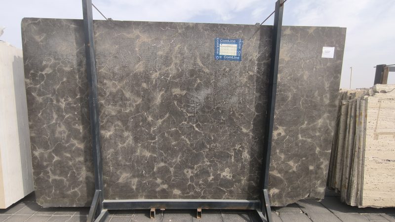 High-quality Armani Brown Marble slab displaying a rich bronze and deep brown background with fine white and golden veining.