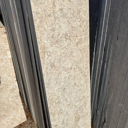 Imperial Marble - Lazulite Marble High-quality Imperial Marble slab displaying a warm cream background intersected by dynamic, chaotic veining in beige and brown tones.