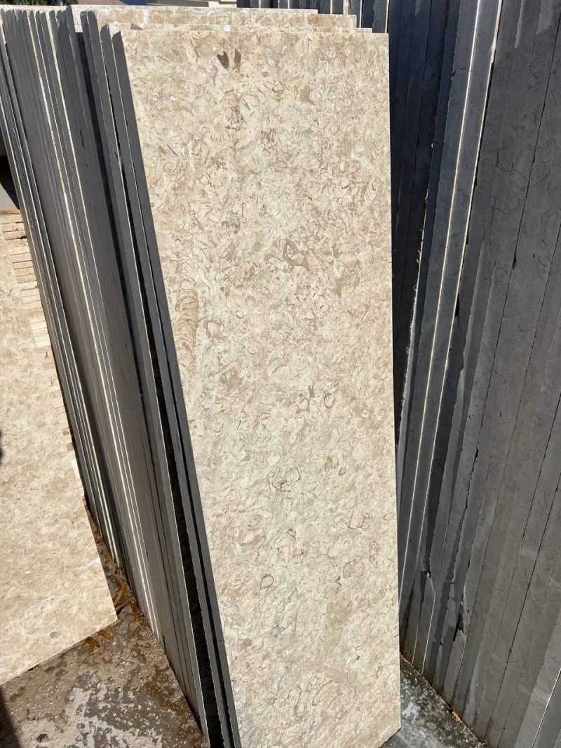 Imperial Marble - Lazulite Marble High-quality Imperial Marble slab displaying a warm cream background intersected by dynamic, chaotic veining in beige and brown tones.